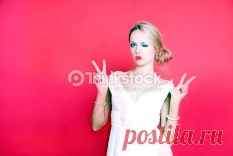 Cool Woman Wearing White Dress On Red Background Stock Photo 452417583 | Thinkstock