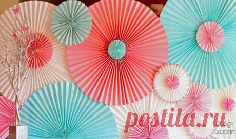 How To Make a Party Backdrop With Paper Window Shades - Design Dazzle How to make a party backdrop out of paper window shades. These rosettes are made from temporary pleated paper shade the kind you use temporarily to cover the window