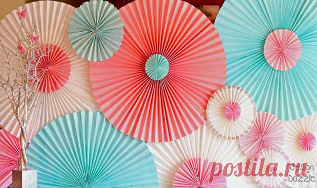 How To Make a Party Backdrop With Paper Window Shades - Design Dazzle How to make a party backdrop out of paper window shades. These rosettes are made from temporary pleated paper shade the kind you use temporarily to cover the window