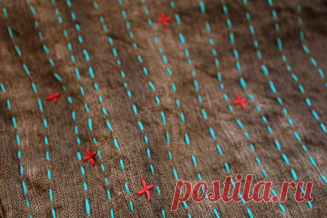 Stitching Detail I copied the pattern from a really cute cotton top I bought in San Miguel but cut it out of beige linen and tie-dyed it in a warm brown color. After I finished it this morning I decided to add some stitched details with turquoise and red embroidery floss.