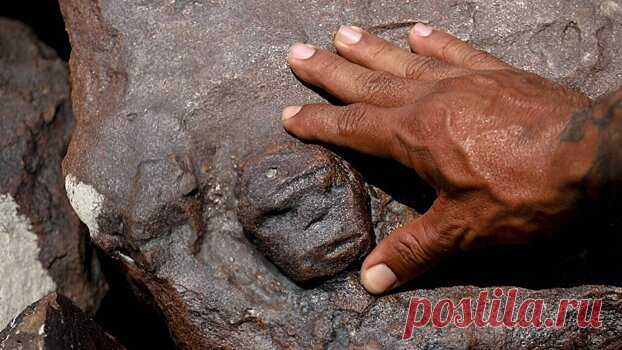Засуха в бразильской Амазонии обнажила 2000-летние вырезанные на скале лица | Pinreg.Ru