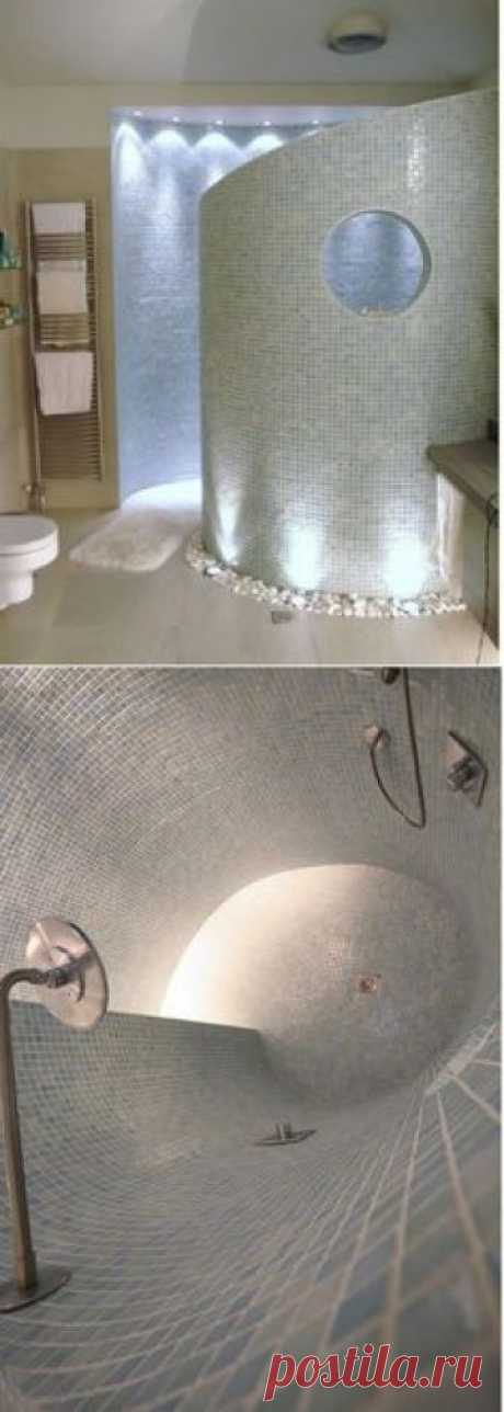 Curved walk in shower with river rocks! Love the lighting, tile, towel warmers, ambiance