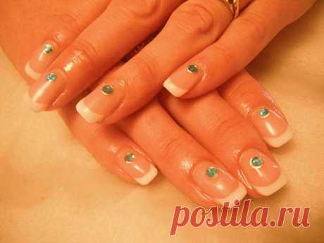Wedding manicure - french nail tips with green crystals