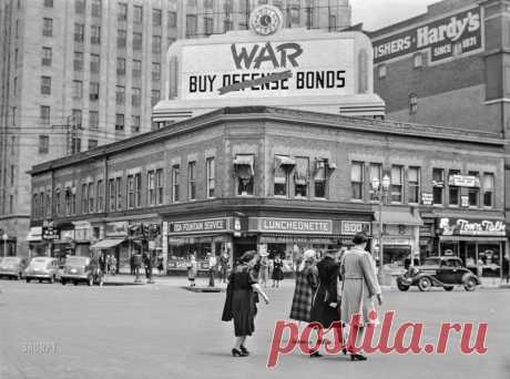 Buy War Bonds: 1942 May 1942. "Street corner in downtown Lincoln during University of Nebraska commencement week." Medium format acetate negative by John Vachon.