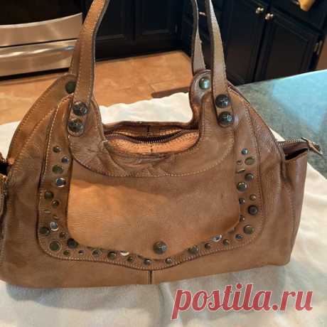 Patricia Nash Vintage Hobo style leather bag Shop smcy50's closet or find the perfect look from millions of stylists. Fast shipping and buyer protection. Great pebbled leather bag with brass tone rivets. Interior with 2 sections and 1 zippered pocket. This bag has minimal wear as pictured, and has a great vintage vibe. Tag is hard to read as pictured. Back of bag has 2 zippered pockets. Front of bag has 1 zippered pocket under the flap.