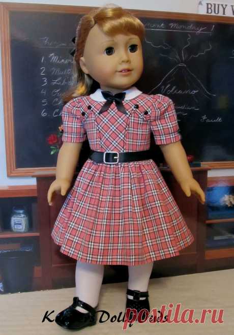 1950s School Dress | Made from a homespun coral, ivory and black plaid, this 50's inspired school dress was made to fit American Girl Doll Maryellen. It features a faux leather belt, bodice details and a white round collar smartly bedecked with a little black bow.