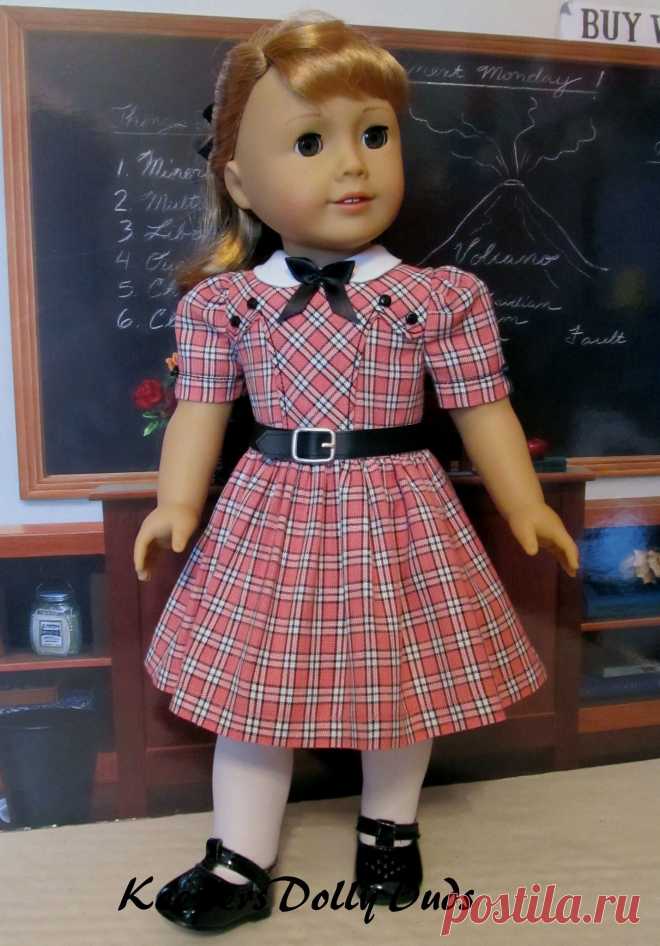 1950s School Dress | Made from a homespun coral, ivory and black plaid, this 50's inspired school dress was made to fit American Girl Doll Maryellen. It features a faux leather belt, bodice details and a white round collar smartly bedecked with a little black bow.