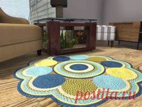 Wing back chair, aquarium coffee table, ottoman, media console, braided rug, and hardwood floors in this living room with painted walls. The window lets you see the exterior of the house and handles to the lawnmower. Try before you buy these traditional decor items with RoomSketcher:  https://planner.roomsketcher.com/?ctxt=rs_com