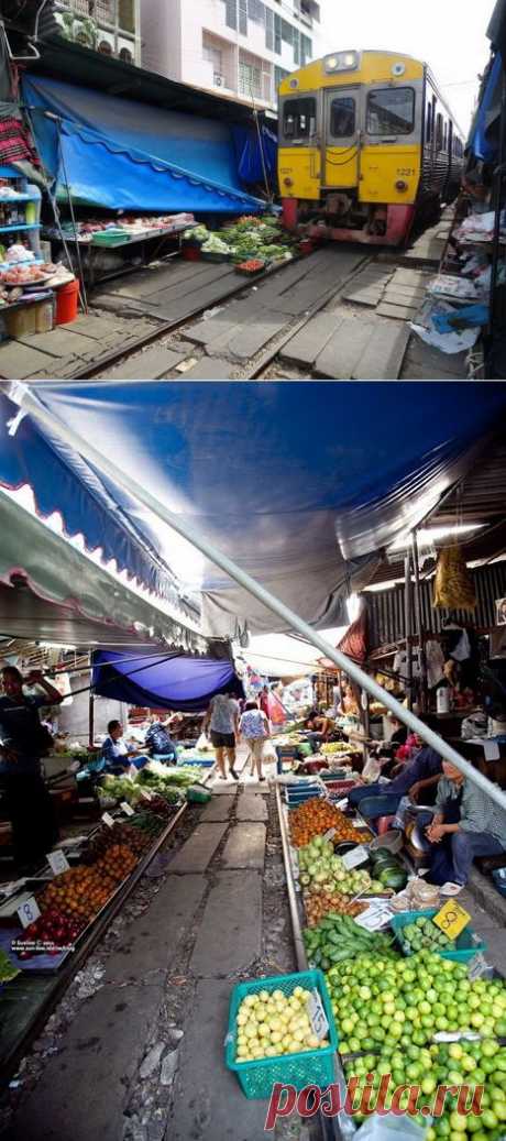 Таиландский рынок Maeklong на железнодорожных рельсах
