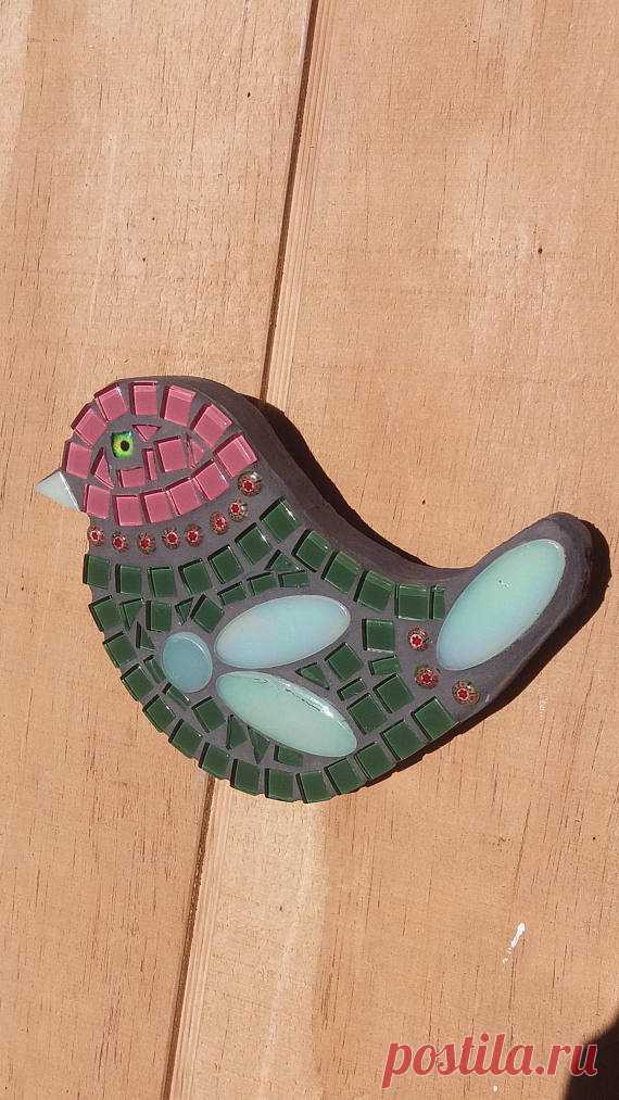 Mosaic Bird - Green with Pink head Green and Pink mosaic bird wall hanging. Please see my other listing for a matching pair.  Made by myself using glass tiles and millefiori glass beads. Bird has been grouted and sealed. The back and sides are painted grey. The base is exterior hardboard and can be hung outside. Size is 17cm across widest point x 13cm in length.