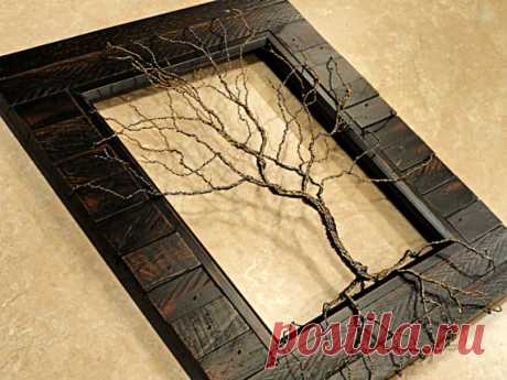 Twisted Wire Tree Sculpture Tree of Life Sculpture Wood Framed Tree This beautifully crafted wire tree sits inside a distressed, dark brown stained, salvaged wood look photo frame. Its branches and roots reach up, out and over the frame, grabbing into nooks and crannies in the frame to hold itself in place, making this tree have a unique 3-D appearance. Tree is made from 22 gauge antique brass and hematite wire, giving it a wonderfully textural and life like look. Frame me...