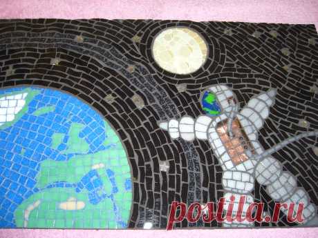 Spaceman Full view, made for Planet Earth exhibition. Materials include glass tiles, ceramic tiles, glass, metal stars, earth grouted in blue, moon grouted in yellow, rest is black.. Size18 1/2in  x11 1/2 in.