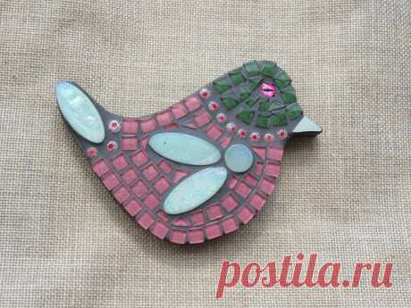 Mosaic Bird - Pink with Green Mosaic Pink with Green head bird wall hanging. Please see my other listing for a matching pair.  Made by myself using glass tiles and millefiori glass beads. Bird has been grouted and sealed. The back and sides are painted grey. The base is exterior hardboard and can be hung outside. Size is 17cm across widest point x 13cm in length.