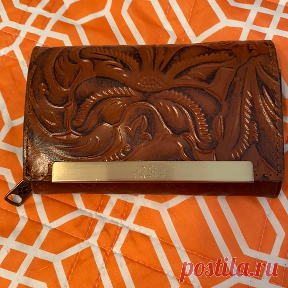 New Patricia Nash fold over wallet. Brown leather. 2 zip compartments inside.  Smoke free/dog friendly home All clothing  items washed, air dried, not ironed.  All known defects/stains pictured & mentioned.