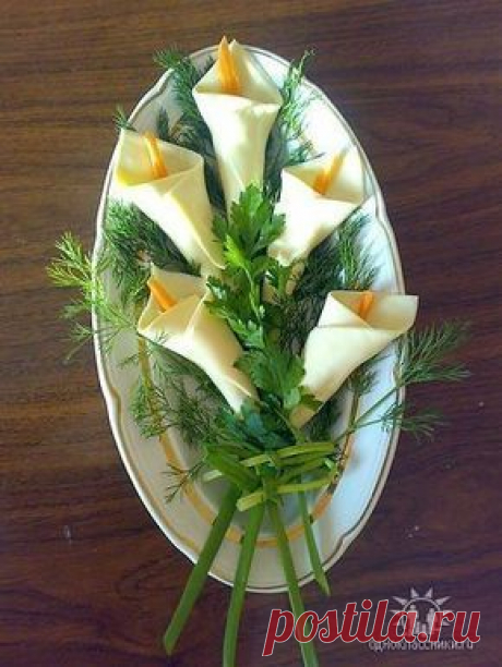 calla lilies from white cheese slices & carrot strips, scallion stems