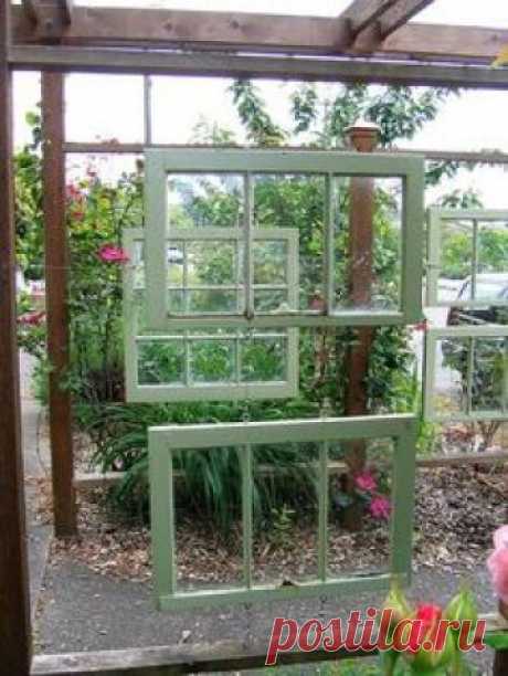 Flickr user lifebegreen - windowed arbor in garden path - via Remodelaholic