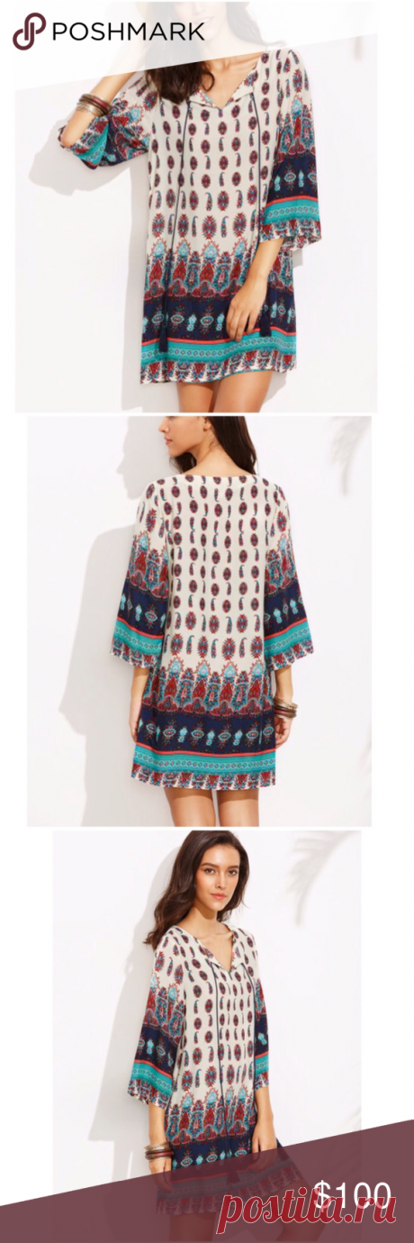 Last1️⃣! Tribal Print Tassel Front Tunic Dress Beautiful & easy-to-wear tunic dress with a lovely navy blue/turquoise/red paisley tribal print on a white background. Wide 3/4 sleeves. Cute navy blue tassels hang from the modest v-neck front. A cute piece for fall! 100% rayon. Small: 39.5" bust, 33" length. Fits loose! No trades/holds/lowballs. Bundle for 10% off! Dresses Long Sleeve