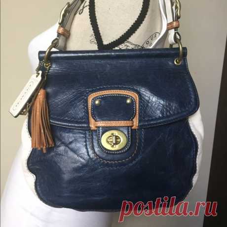Coach Limited Edit. Willis Leather Bag M1169-19031 Shop notoole's closet or find the perfect look from millions of stylists. Fast shipping and buyer protection. This bad is so cute! It is navy and white color blocked with tan and gold detail. Gold hardware. The long cross-body strap is removeable. It has outside pocket for phone and/or keys. I was surprised by how much it could fit! Roughly 10x9x4" measurements. Slight dirty on underside but otherwise in excellent conditio...