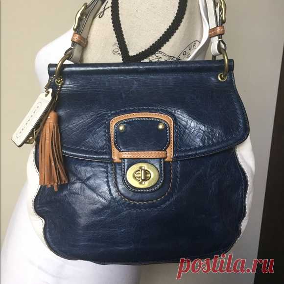 Coach Limited Edit. Willis Leather Bag M1169-19031 Shop notoole's closet or find the perfect look from millions of stylists. Fast shipping and buyer protection. This bad is so cute! It is navy and white color blocked with tan and gold detail. Gold hardware. The long cross-body strap is removeable. It has outside pocket for phone and/or keys. I was surprised by how much it could fit! Roughly 10x9x4