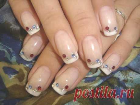 Wedding manicure - colorless base with red and blue glittering nail polish dots