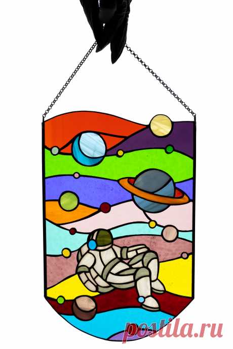 Stained glass panel Astronaut Window hanging suncatcher Stain glass de Astronaut window hanging suncatcher made of stained glass pieces by my own disign.Handmade using Tiffany copper foil technique.Looks amazing in the sunlight.You will get it completely ready for installation. It comes with a self-adhesive hook and copper chain.It will be a great gift for friends or relatives. Width: 8 i
