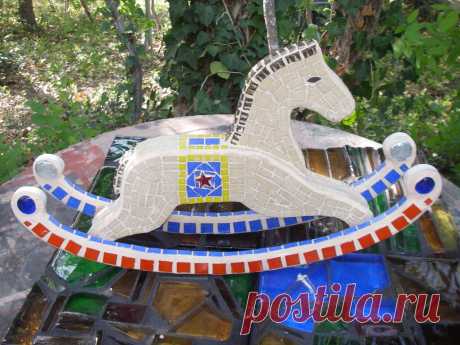 Mosaic Rocking Horse Mosaic rocking horse 12" high using vitreous glass and marbles.  This was  so hard to grout!  Too many sides at once.