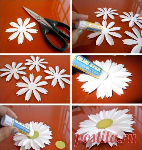 Use a large punch. Notch ends of petals and crease each. Layer 4. Add a center. Attach several to strings (fishing line?) and hang at different lengths over buffet table or on one end of a patio cover, or ...