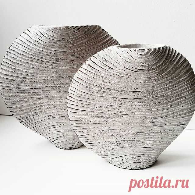 A new pair of moon vessels in black stoneware with white textured glaze.