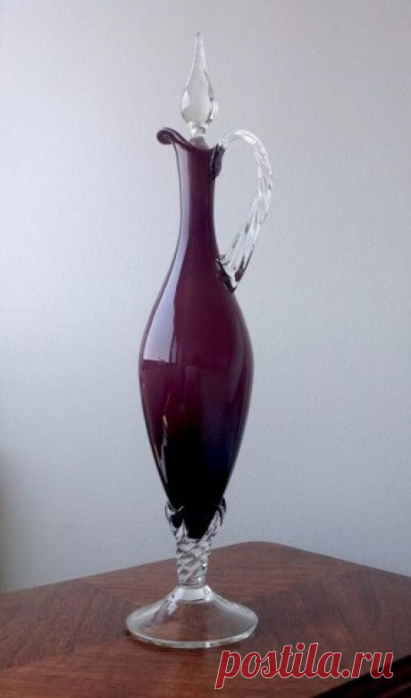 Mid Century Empoli Italian Amethyst Cased Art Glass & Crystal Ewer Decanter  | eBay Stunningly elegant Empoli region Italian mid century ewer/decanter in deep amethyst blown cased glass with twisted crystal base, handle and flame stopper! In great shape but does have one small area of chipping where the top of the handle is applied (see last photo) which is not affecting it's function or usability, and one little rough spot on body of stopper more like a popped bubble. Dis...