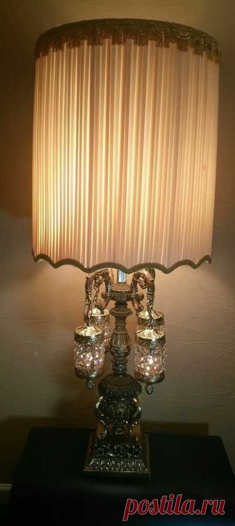 Vintage Hollywood Regency Brass Crystal Prisms Waterfalls Table Lamp 5 Lights   | eBay Gorgeous Brass table lamp with the original shade. Lit by four waterfall crystal prisms on ornate arms, all under the practical main bulb and large shade. I HAVE NOT TRIED TO CLEAN THE SHADE,THE MATERIAL HAS A SATIN FEEL AND LOOK ALTHOUGH I AM NOT CERTAIN OF WHAT IT IS MADE OF.IT IS A MASSIVE SHADE. | eBay!