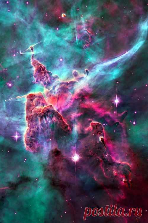 Carina Nebula, NGC 3372, sur-rounds several clusters of stars. Eta Carina & HD 93129A, two of the most massive & luminous stars in the Milky Way, are among them. At an est 6,500 10,000 ly away, it is one of the largest nebulae ever seen (larger & brighter than the Orion nebula) the top is a 3-ly-tall pillar of cool hydrogen being worn away by the radiation of nearby stars. Carina Constellation