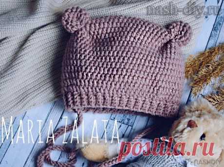 ВЯЗАНАЯ ШАПКА С УШКАМИ КРЮЧКОМ МЕДВЕЖОНОК,
описание: https://nash-diy.ru/vjazanie-aksessuary/golovnye-ubory..