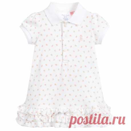 White & Pink Baby Dress Set Baby girls white dress and knickers set from Ralph Lauren, with a pink floral print. Both pieces are made in soft cotton jersey, with ribbed trim on the dress. There are pretty ruffles on the hem and the designer's iconic small pony logo embroidered on the chest.
