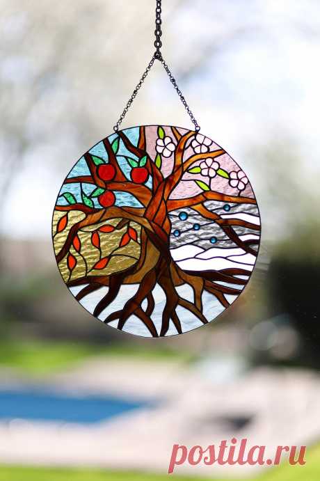 Stained glass suncatcher Four Seasons Tree of Life Stain glass panel P Four Seasons window hanging suncatcher made of stained glass pieces by my own disign.Handmade using Tiffany copper foil technique.Looks amazing in the sunlight.You will get it completely ready for installation. It comes with a self-adhesive hook and copper chain.It will be a great gift for friends or relatives.