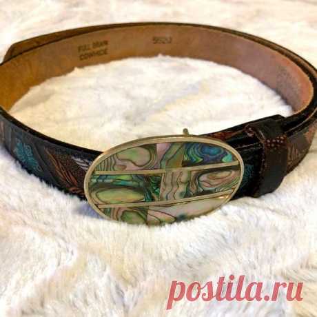 Excellent preowned condition with no flaws. No creasing or fading. Abalone and silver metal (not real silver) buckle. Tooled leather belt with an Eagle and butterfly motif. Brown with orange and turquoise. Very cool belt that looks like it was hardly used. Approximate measurements in photos. Please comment with any questions and thank you for looking!