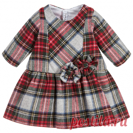 Red Wool Tartan Dress A red and grey tartan wool blend dress for little girls by Mebi. This smart dress has an all over tartan pattern and is decorated on the front with matching tartan flowers. The dress is fully lined in soft cotton cloth for comfort and fastens on the back with buttons.
