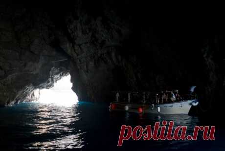 (5) This is Montenegro
Entering the this blue cave itself at first seems like a daunting experience – the rock above the entrance is low and as your eyes adjust, everything seems to be cast in extreme darkness. However, after realizing that the cavern is large enough to accommodate several boats, you pass a small bend and realize why this natural wonder is called the Blue Cave – luminous, brilliant blue light wells up from under the water and casts a blue shadow on the grotto’s ceiling above yo