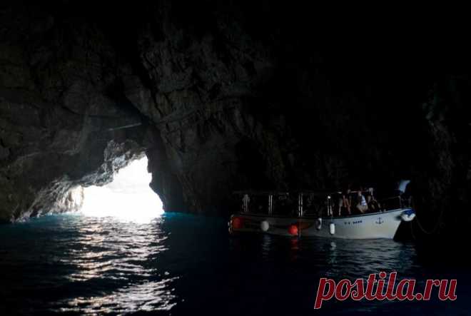 (5) This is Montenegro
Entering the this blue cave itself at first seems like a daunting experience – the rock above the entrance is low and as your eyes adjust, everything seems to be cast in extreme darkness. However, after realizing that the cavern is large enough to accommodate several boats, you pass a small bend and realize why this natural wonder is called the Blue Cave – luminous, brilliant blue light wells up from under the water and casts a blue shadow on the grotto’s ceiling above yo