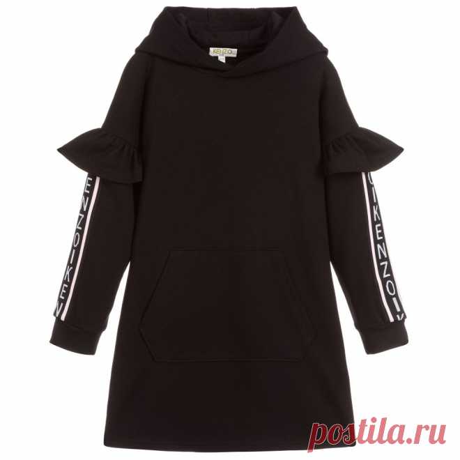 Girls Black Hooded Dress Girls black hooded dress by Kenzo Kids, made in soft and comfortable viscose jersey in a relaxed fit. The dropped sleeves have pretty frilled details with pale pink, grey and black knitted logo tape along the outside seams.
