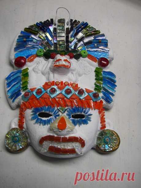 Aztec Mask WIP I found another clay mask in the woods so it is being decorated with stained glass, beads, shell, marbles, green chalk turquoise, millefiori and Van Gogh glass.  So far.