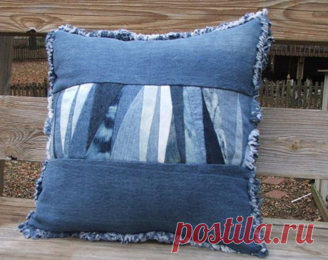 Denim patchwork pillow sham with form. The front is sewn using triangle shaped scraps cut from recycled denim from multiple pairs of jeans.