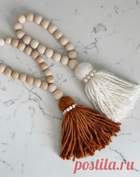 These beaded tassels are adorable ! The handles are made fro natural wooden beads and also have wooden beads going around the top pom. These are so pretty and so neutral for your home and decor! Each…