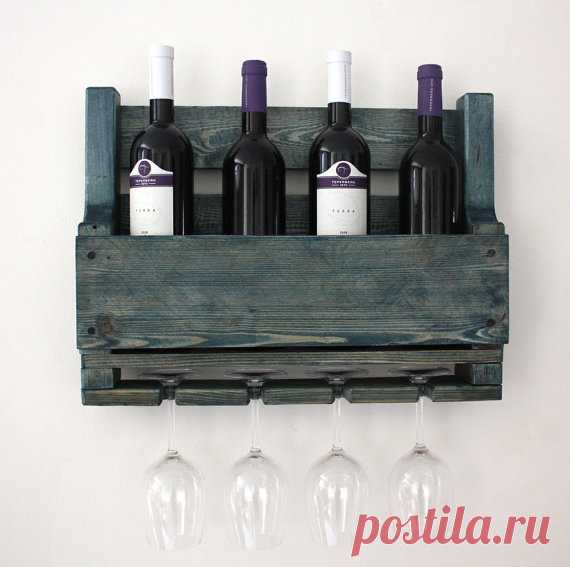 Beautiful small  rustic wine rack made from reclaimed pallets Another amazing product for our wine racks collection. This rack would look amazing in a cigar bar or next to your alcohol collection at home or office.  This four bottle, 4 glass wine rack is made from reclaimed pallets. This is a fabulous way to display your love for wine and a little home or working place decor at the same time!  It has hangers on the back and we send you the screws, dibbles and materials you...
