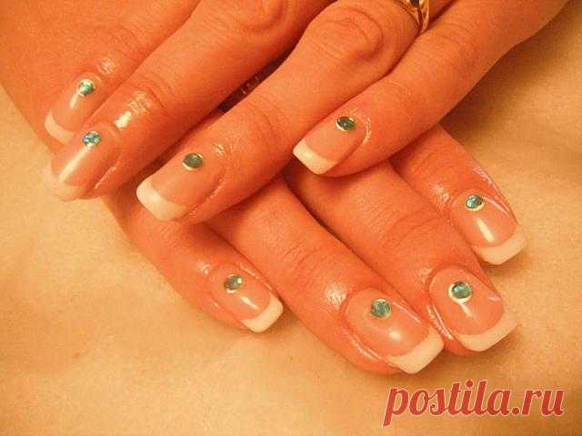 Wedding manicure - french nail tips with green crystals