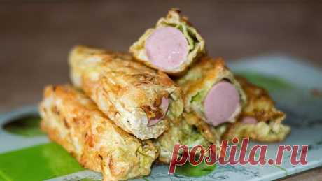Капустные рулетики с сосисками - очень простая и вкусная закуска 
Очень простая и безхитростная закуска в виде рулетиков из пекинской капусты с сосисками. Приготовить ее дело 5 - 10 минут. В итоге получается быстрое и вкусное блюдо, можно даже сказать ленивые голуб…
