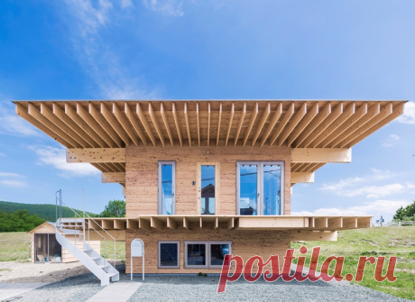 jun igarashi tops japanese residence with an oversized hat roof jun igarashi worked with a limited budget to realize this compact residence where all the timber structural elements have been left exposed.