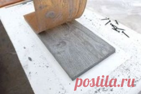 Make rubber mold with wood grain, then cast concrete. (I'll never do it, but it looks so cool!)