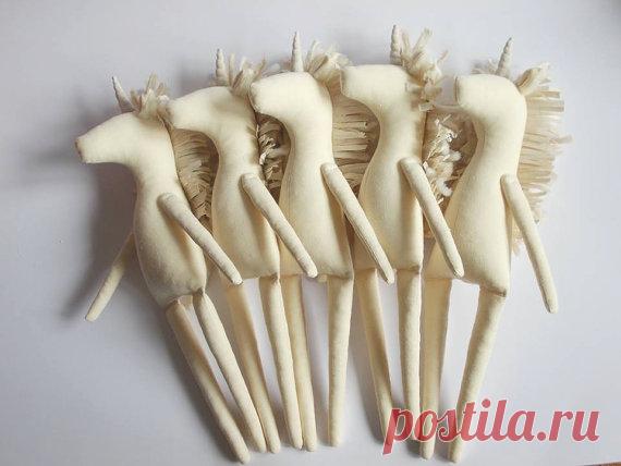 Blank Doll BODY is 12 inches (31 cm) tall .
PDF Unicorn pattern for you... 
Fabric doll body is made of white cotton and linen and it is filled with hypo-allergenic polyester fiberfill. Mane is made of yarn.

These pre-made doll bodies are perfect if you wish to make the art doll but don't have the time to make the body.