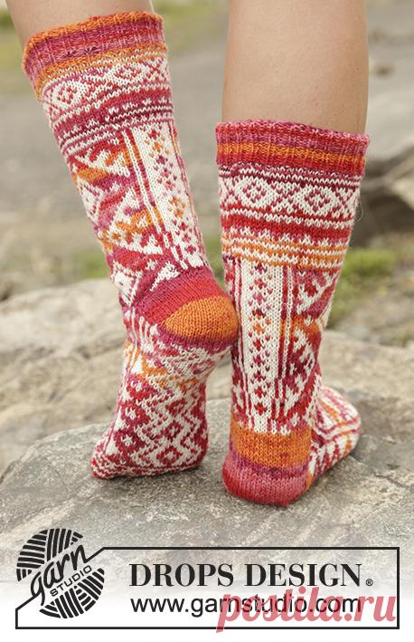 Mexican Sunset - Knitted DROPS socks with Nordic pattern worked from toe up in ”Fabel”. Size 35 - 43 - Free pattern by DROPS Design