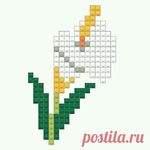 an image of a flower made out of lego blocks with the colors yellow, orange and green